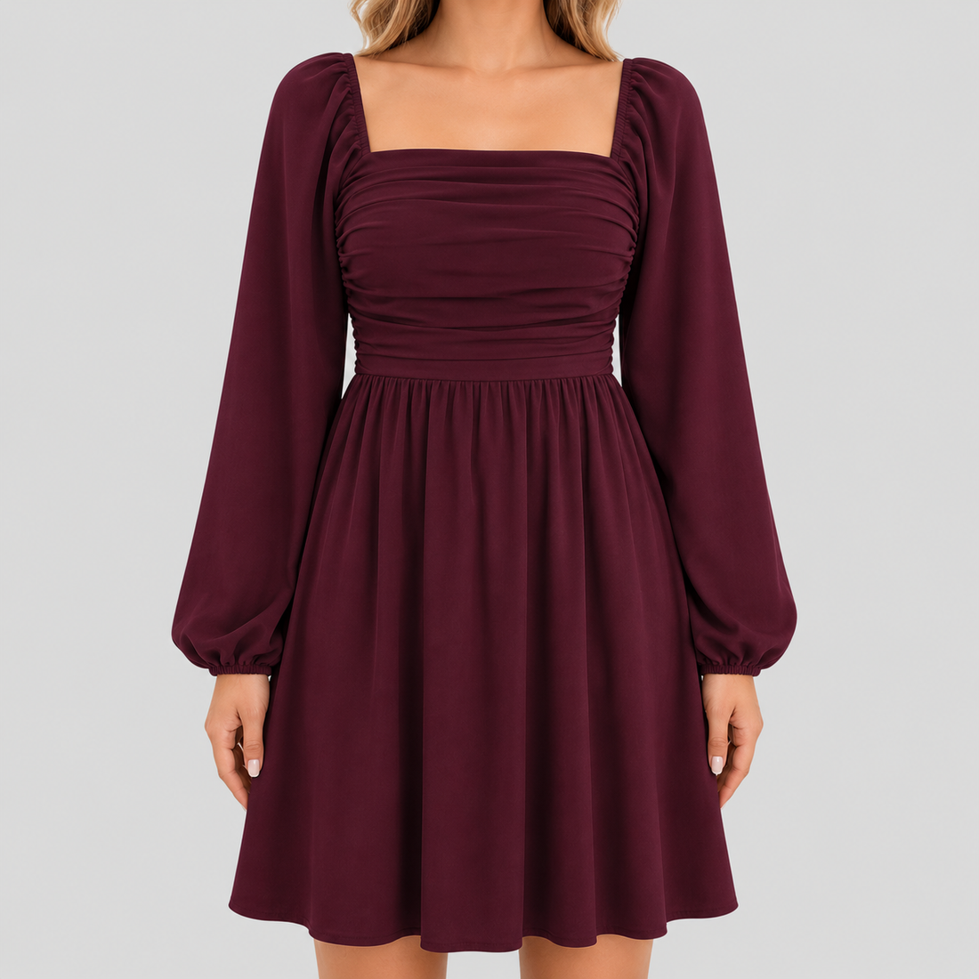 Long sleeve mini dress with square neckline, pleated bodice, defined waist, and flowy fit-and-flare silhouette