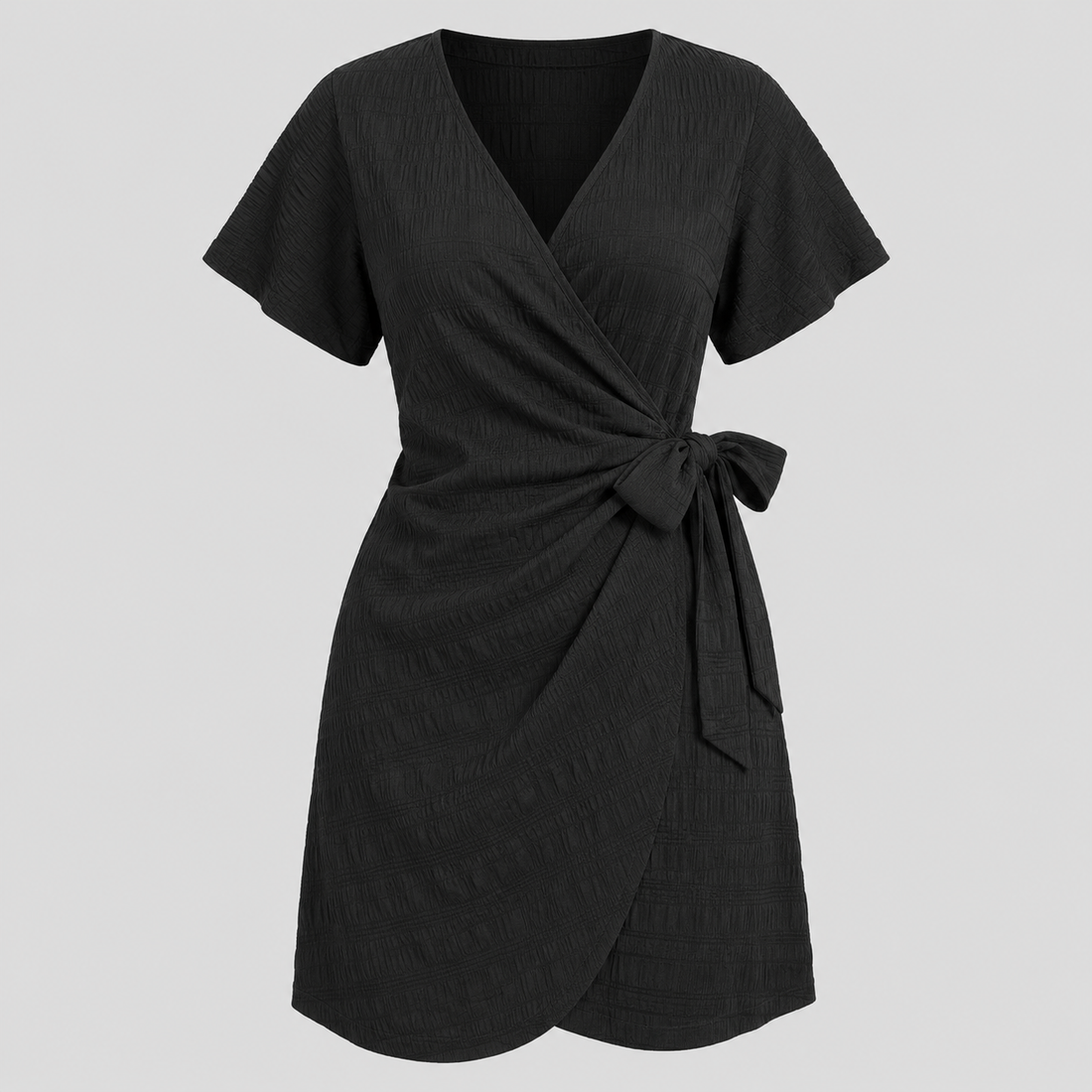 Short sleeve wrap mini dress with surplice V-neckline, side tie waist, and textured fabric