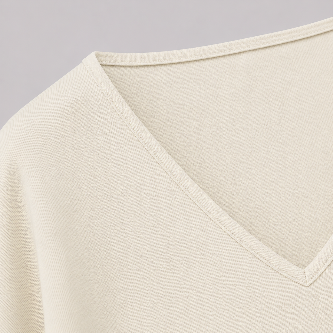 V-neck fitted top with gathered waist, long drape sleeves, and a sleek modern silhouette