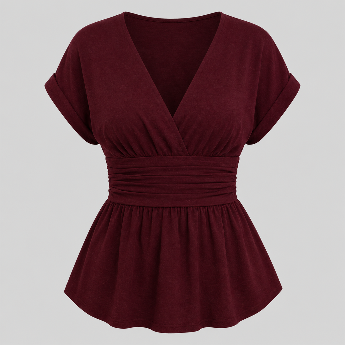 Cap sleeve peplum blouse with surplice V-neckline, wide cinched waistband, and flowy hem for an elegant flattering fit