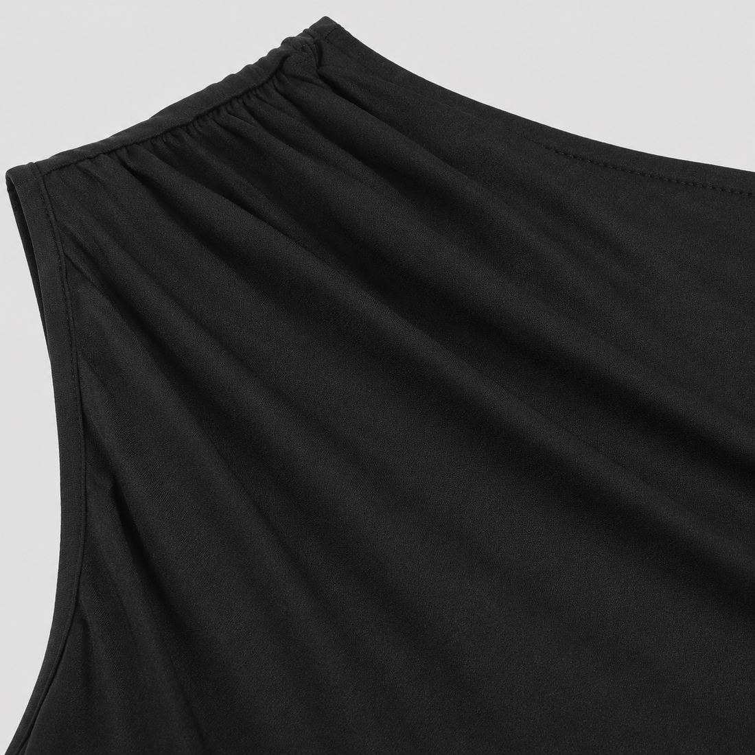 One-shoulder ruched fitted top with asymmetrical neckline and sleek body-contouring silhouette