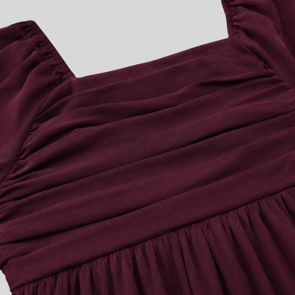 Long sleeve mini dress with square neckline, pleated bodice, defined waist, and flowy fit-and-flare silhouette