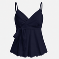 Sleeveless wrap-front peplum cami top with spaghetti straps and adjustable waist tie, styled for elegant everyday wear