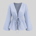 Striped tie-waist blouse with deep V-neck open front, long bell sleeves, and flared hem for a feminine tailored silhouette