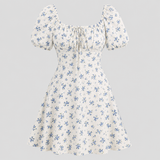 Floral mini dress with square neckline, front tie detail, short puff sleeves, and fit-and-flare silhouette