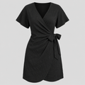 Short sleeve wrap mini dress with surplice V-neckline, side tie waist, and textured fabric