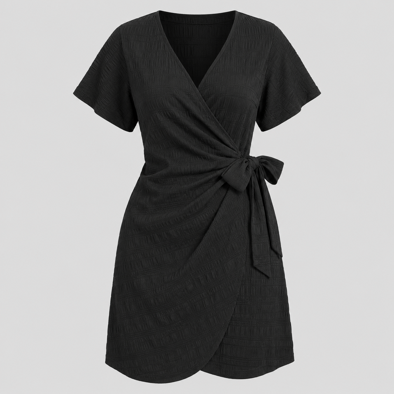 Short sleeve wrap mini dress with surplice V-neckline, side tie waist, and textured fabric