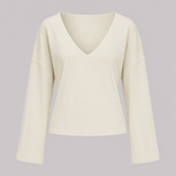 V-neck fitted top with gathered waist, long drape sleeves, and a sleek modern silhouette