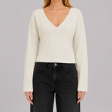 V-neck fitted top with gathered waist, long drape sleeves, and a sleek modern silhouette
