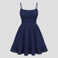 Sleeveless mini sundress with square neckline, smocked waistband, textured fabric, and flared ruffle hem