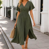 Flutter sleeve maxi dress with surplice V-neckline, smocked waistband, and flowing floor-length silhouette